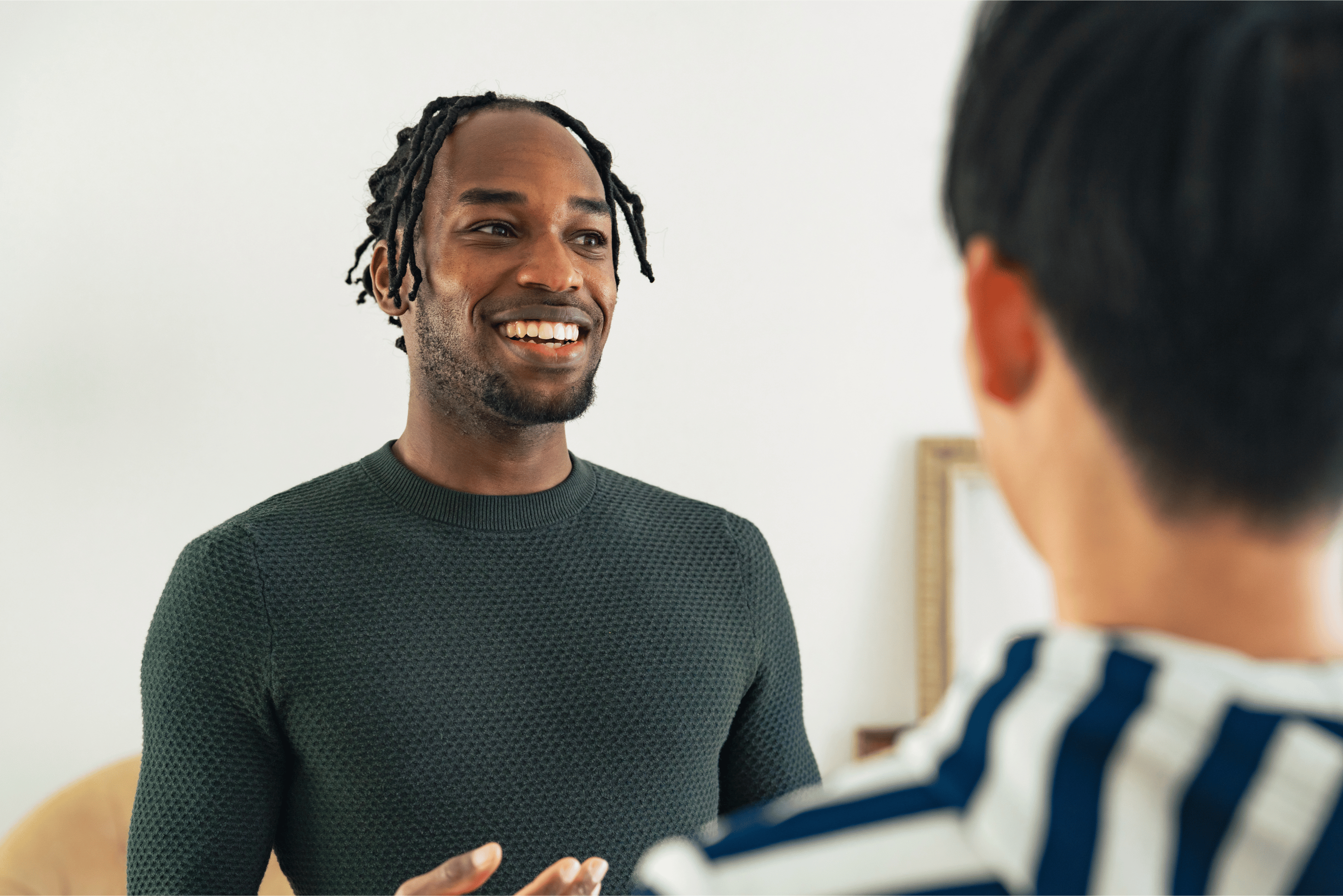 Person having a conversation smiling