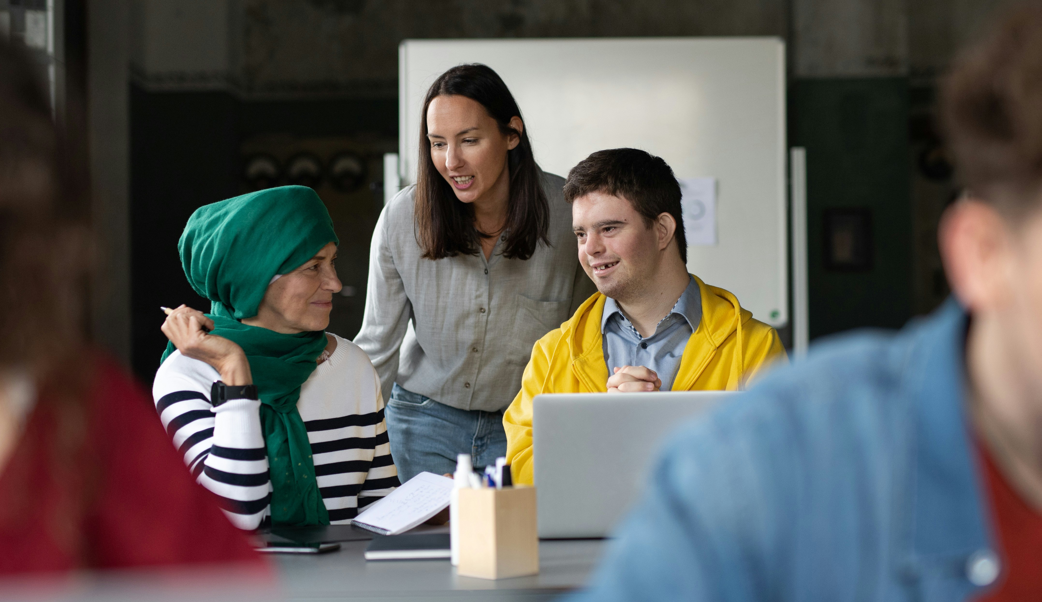 group of people collaborating on some work together