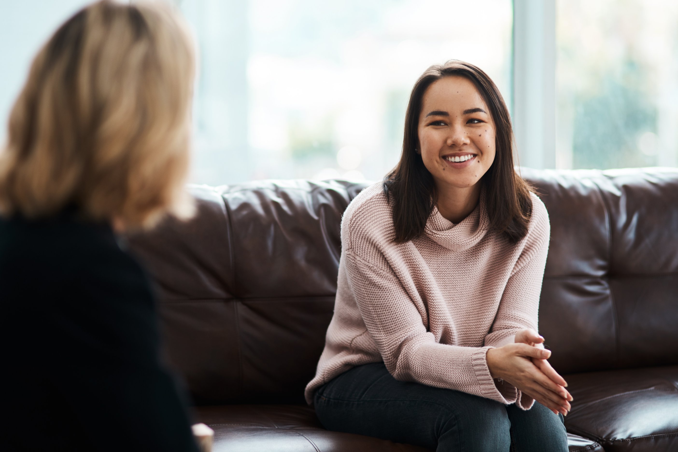 person-sitting-on-sofa-smiling