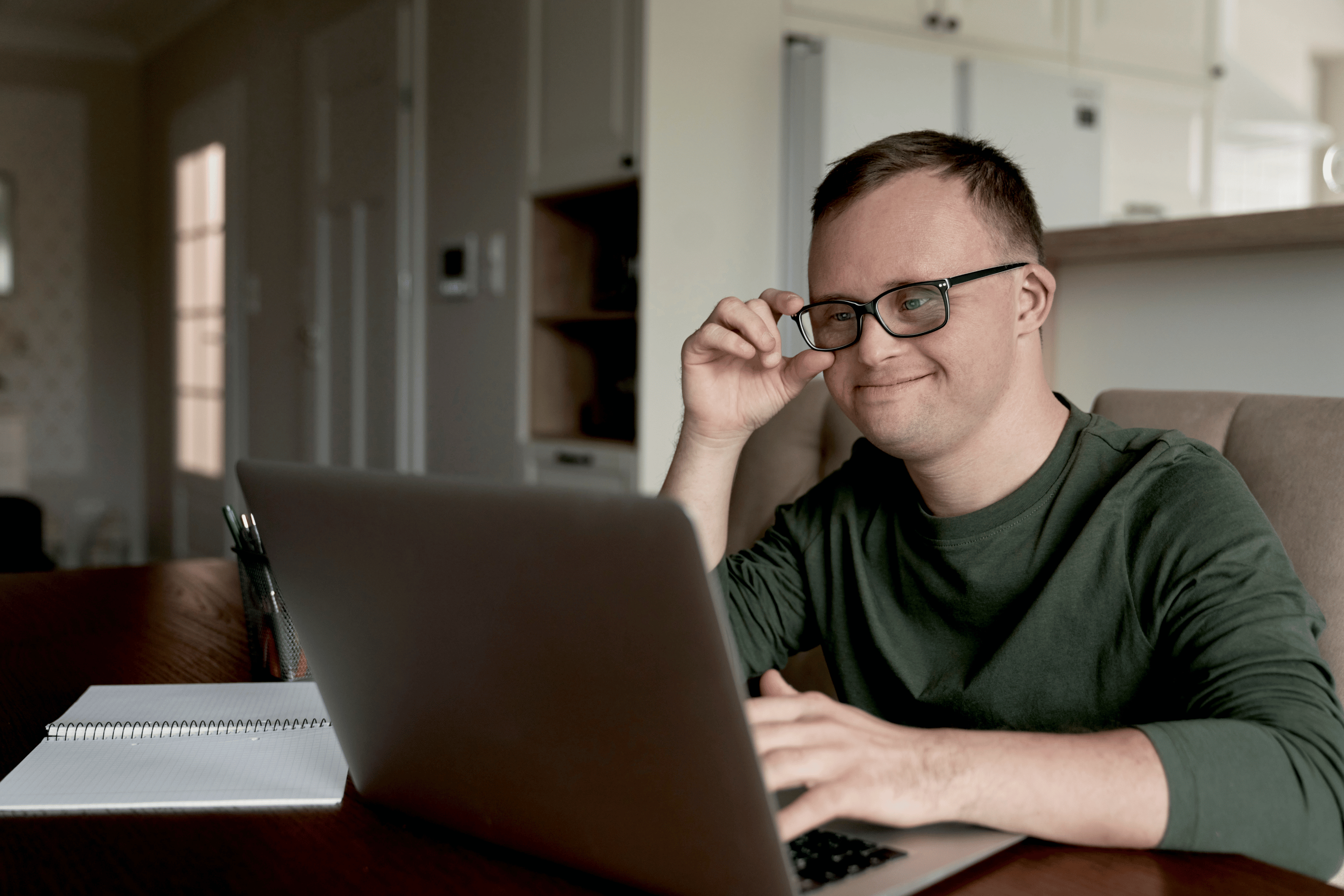 person-with-glasses-looking-at-laptop