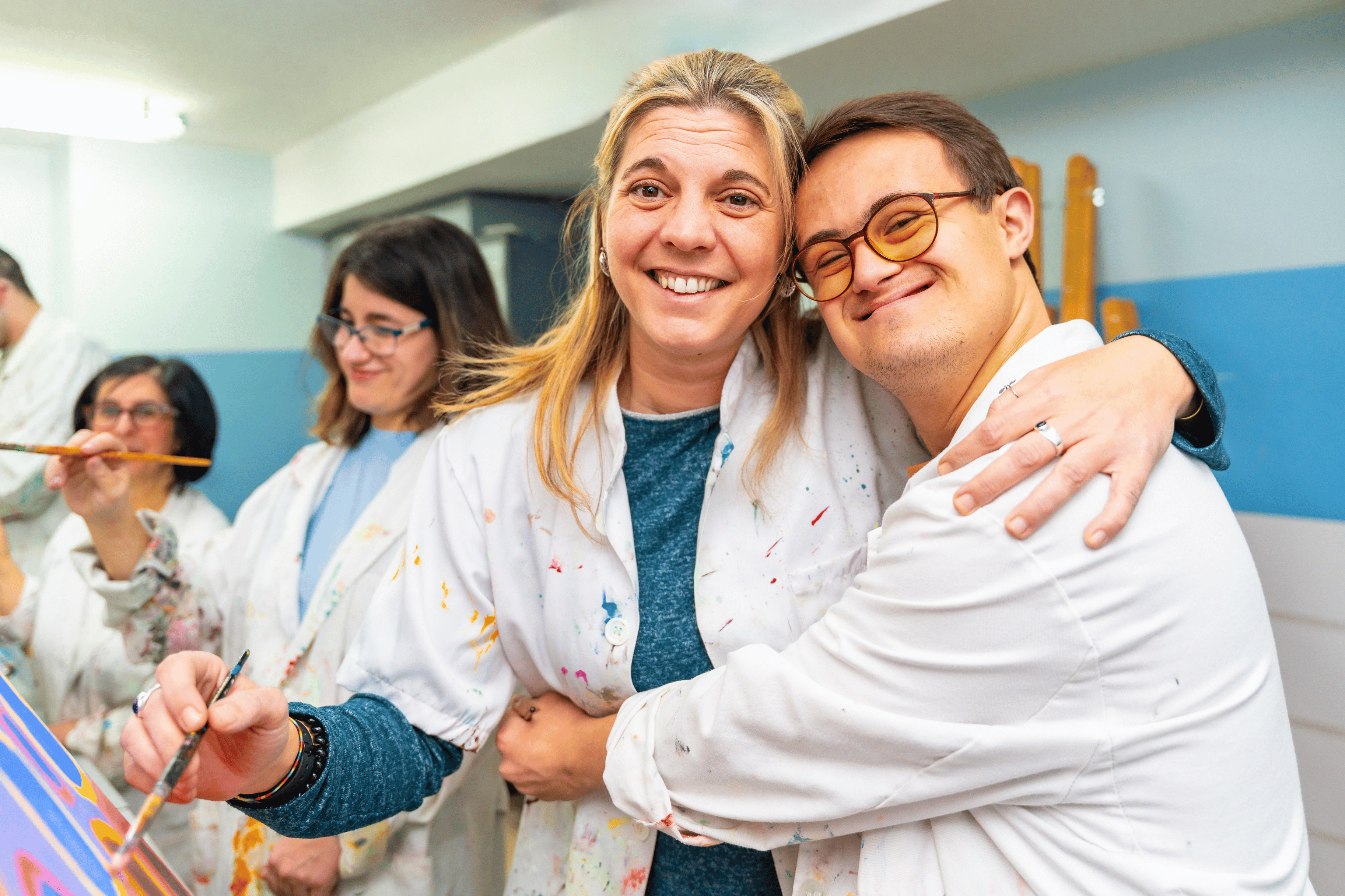 service-user-and-art-therapist-hugging