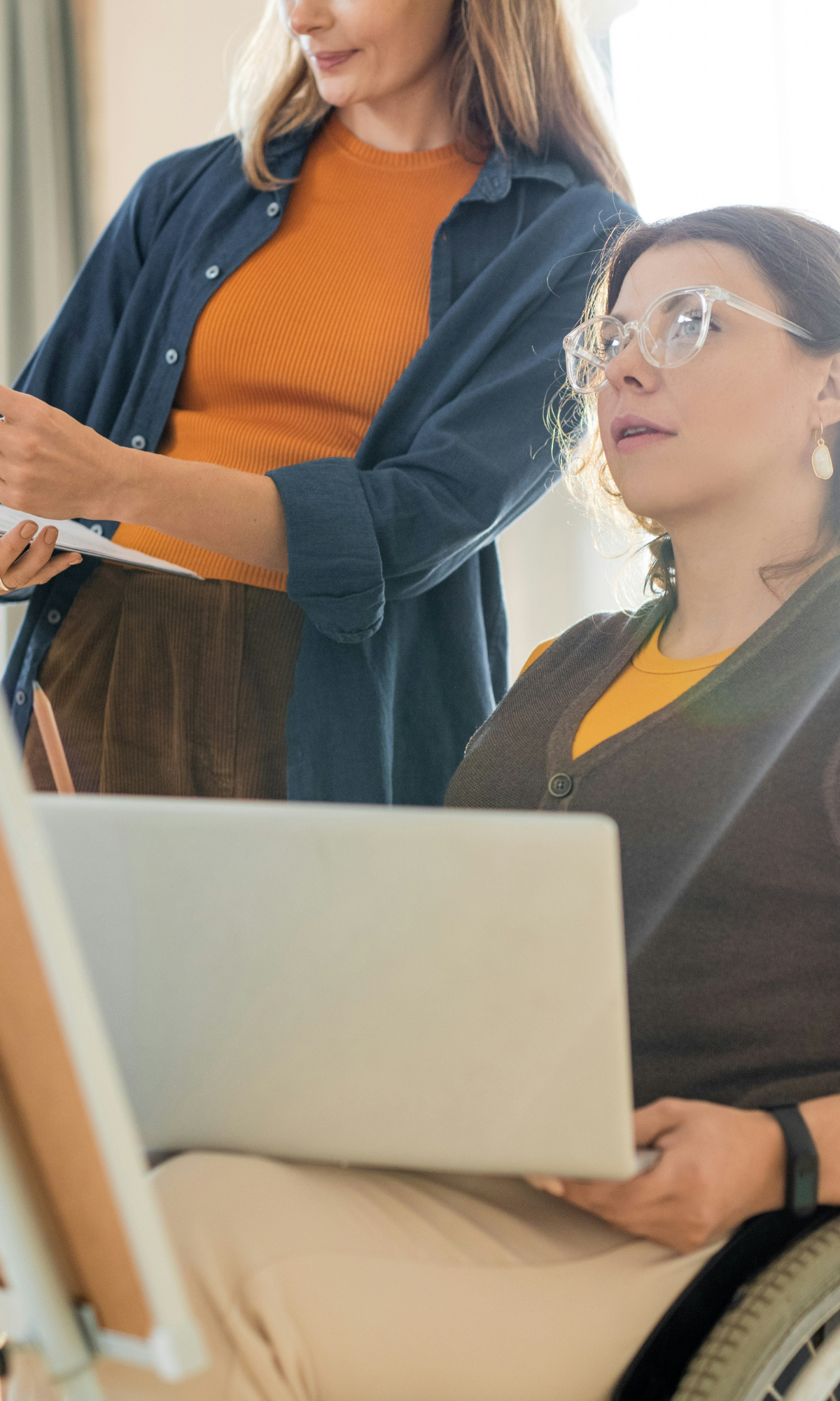 woman holding laptop